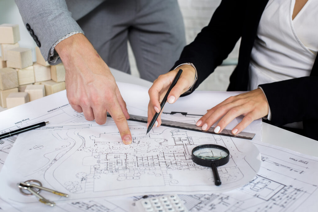 team members analyzing architectural plan